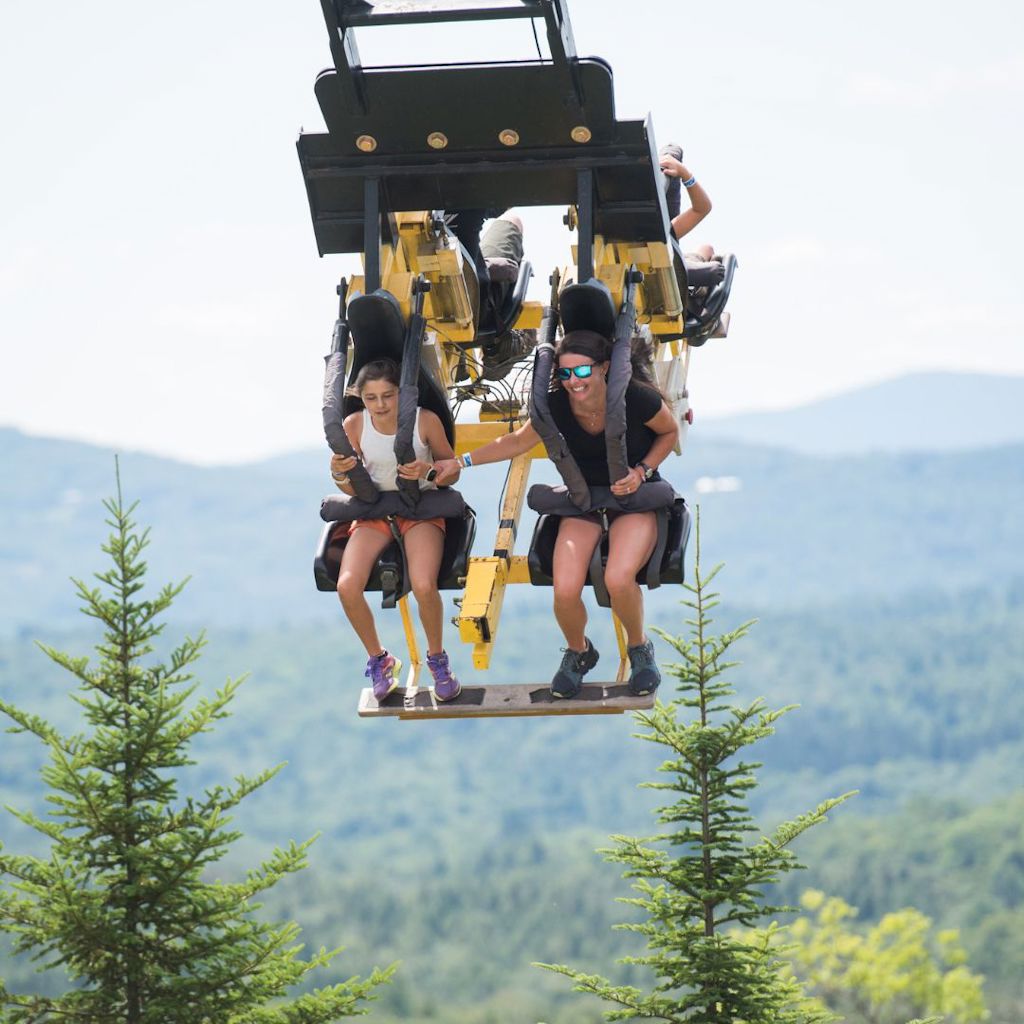 family on giant swing ride at vermonts summer adventure